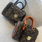 BOLSO BAÚL LV CON BOLSILLO